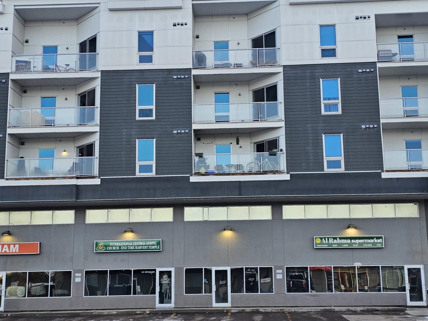 A front of a building with lots of windows